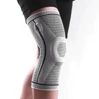 Knee brace on a person's knee with a white background
